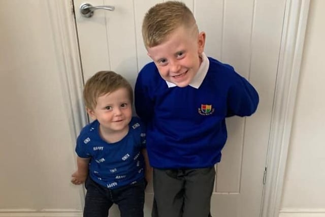 Back to school in South Tyneside. Charlie, age 7, with little brother Harry, age 1.