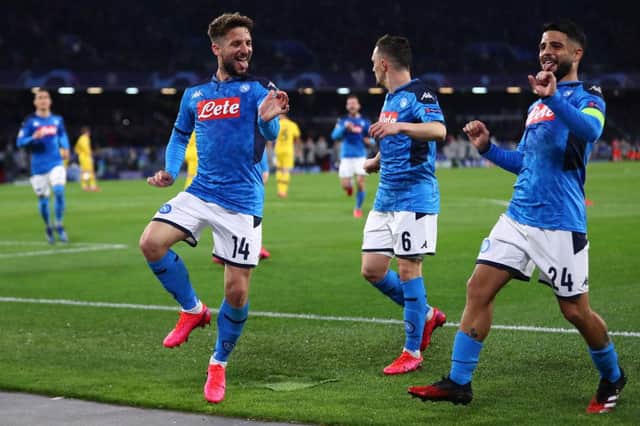 NAPLES, ITALY - FEBRUARY 25: Dries Mertens (L) of Napoli celebrates scoring the opening goal alongside Lorenzo Insigne (R)  during the UEFA Champions League round of 16 first leg match between SSC Napoli and FC Barcelona at Stadio San Paolo on February 25, 2020 in Naples, Italy. (Photo by Michael Steele/Getty Images)