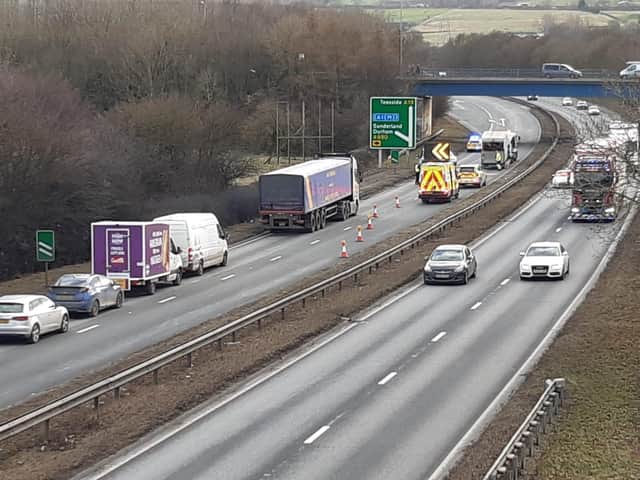Recovery vehicles removing the vehicles involved in the collision.