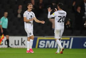 MILTON KEYNES, ENGLAND - SEPTEMBER 28: Scott Twine of Milton Keynes Dons  celebrates with Troy Parrott after scoring his and his sides second goal during the Sky Bet League One match between Milton Keynes Dons and Fleetwood Town at Stadium mk on September 28, 2021 in Milton Keynes, England. (Photo by Pete Norton/Getty Images)