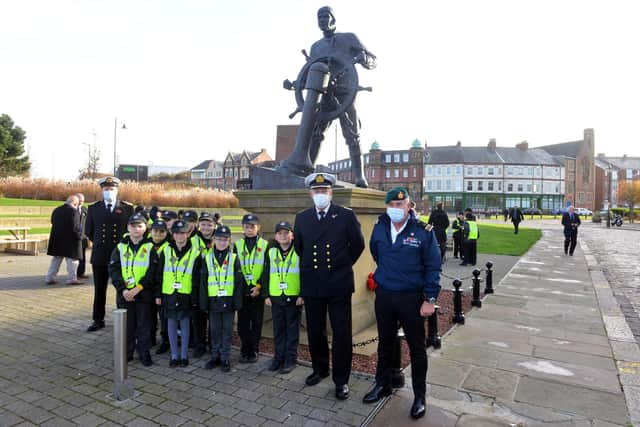 Captain of Arcadia Ashley Cook arrives at the Mill Dam for the Armistice Day service with his crew James O'Neill, chief engineer and Grant Williams, ship security officer.