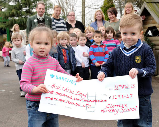 Jarrow's Clervaux Nursery pupils with their cheque for £1,192 raised for Red Nose Day funds.