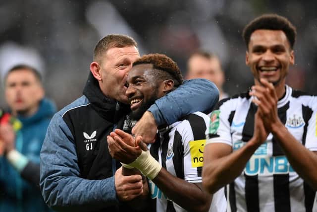 Allan Saint-Maximin of Newcastle United celebrates with Graeme Jones, assistant coach of Newcastle United following their victory in the Carabao Cup Semi Final 2nd Leg match between Newcastle United and Southampton at St James' Park on January 31, 2023 in Newcastle upon Tyne, England. (Photo by Stu Forster/Getty Images)