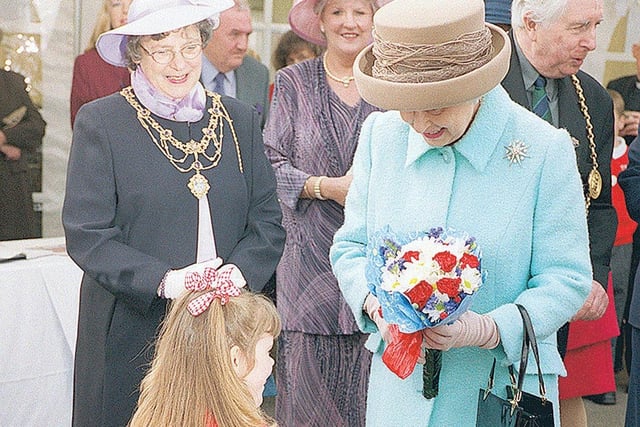 Do you recognise the pupil who got the honour of presenting flowers to the Queen?