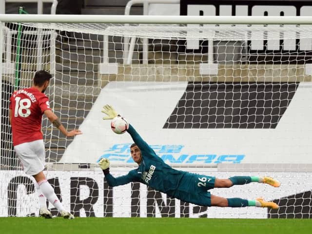 Karl Darlow stops a penalty from Bruno Fernandes.