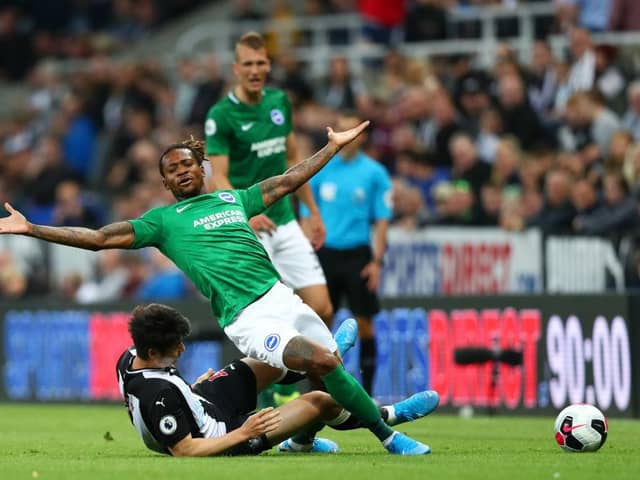 NEWCASTLE UPON TYNE, ENGLAND - SEPTEMBER 21: Gaetan Bong of Brighton & Hove Albion battles for the ball with Ki Sung-Yueng of Newcastle United during the Premier League match between Newcastle United and Brighton & Hove Albion at St. James Park on September 21, 2019 in Newcastle upon Tyne, United Kingdom. (Photo by Dan Istitene/Getty Images)