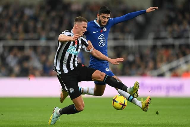 Sven Botman of Newcastle United is challenged by Armando Broja of Chelsea during the Premier League match between Newcastle United and Chelsea FC at St. James Park on November 12, 2022 in Newcastle upon Tyne, England. (Photo by Stu Forster/Getty Images)