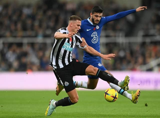 Sven Botman of Newcastle United is challenged by Armando Broja of Chelsea during the Premier League match between Newcastle United and Chelsea FC at St. James Park on November 12, 2022 in Newcastle upon Tyne, England. (Photo by Stu Forster/Getty Images)