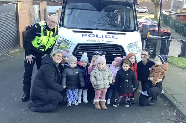 Constable Darren Lough with staff and youngsters at Nurserytime.