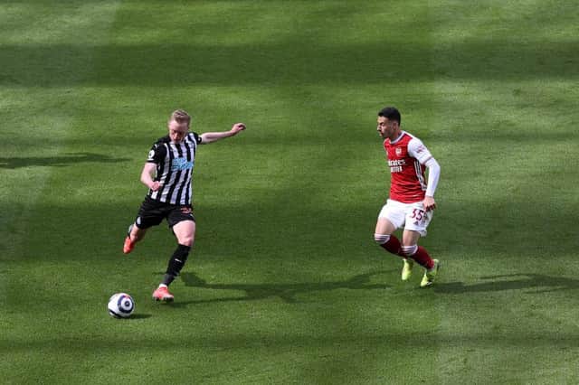 Sean Longstaff of Newcastle United is closed down by Gabriel Martinelli of Arsenal during the Premier League match between Newcastle United and Arsenal at St. James Park on May 02, 2021 in Newcastle upon Tyne, England.