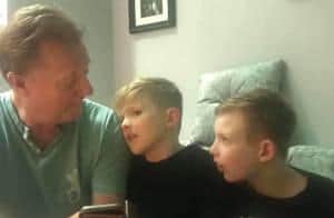 John with his two grandchildren