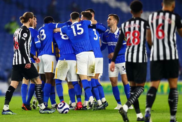 Leandro Trossard of Brighton & Hove Albion celebrates with teammates after scoring their team's first goal during the Premier League match between Brighton & Hove Albion and Newcastle United.