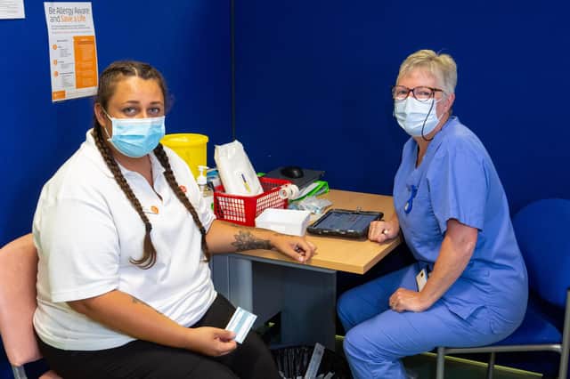 Mikaila Patterson and a vaccinator at The Glen Medical Group