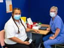 Mikaila Patterson and a vaccinator at The Glen Medical Group