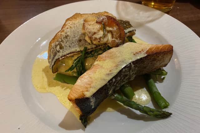 Trio of fish, seabass, salmon and scallop on a bed of crushed potato, asparagus and samphire at the Anglers Arms, Weldon Bridge.