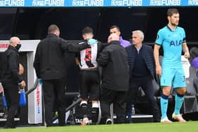NEWCASTLE UPON TYNE, ENGLAND - JULY 15: Fabian Schar of Newcastle United leaves the pitch with an injury during the Premier League match between Newcastle United and Tottenham Hotspur at St. James Park on July 15, 2020 in Newcastle upon Tyne, England.