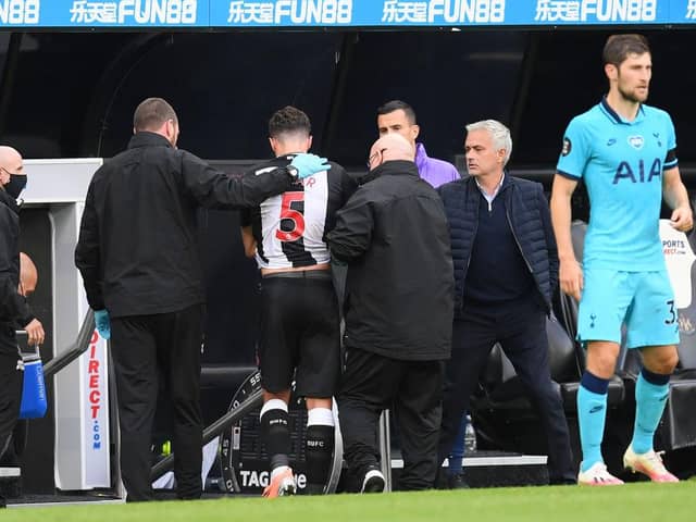 NEWCASTLE UPON TYNE, ENGLAND - JULY 15: Fabian Schar of Newcastle United leaves the pitch with an injury during the Premier League match between Newcastle United and Tottenham Hotspur at St. James Park on July 15, 2020 in Newcastle upon Tyne, England.