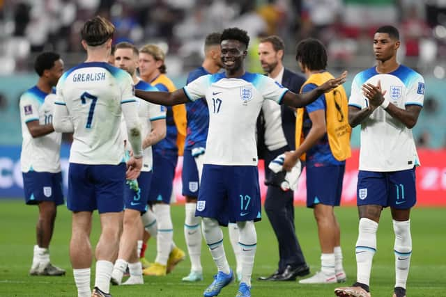 England's Bukayo Saka with Jack Grealish following the FIFA World Cup Group B match at the Khalifa International Stadium, Doha.