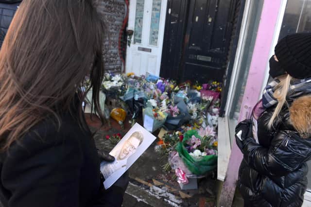 Tributes were left outside Stoney's Barber Shop.