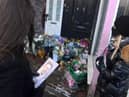 Tributes were left outside Stoney's Barber Shop.
