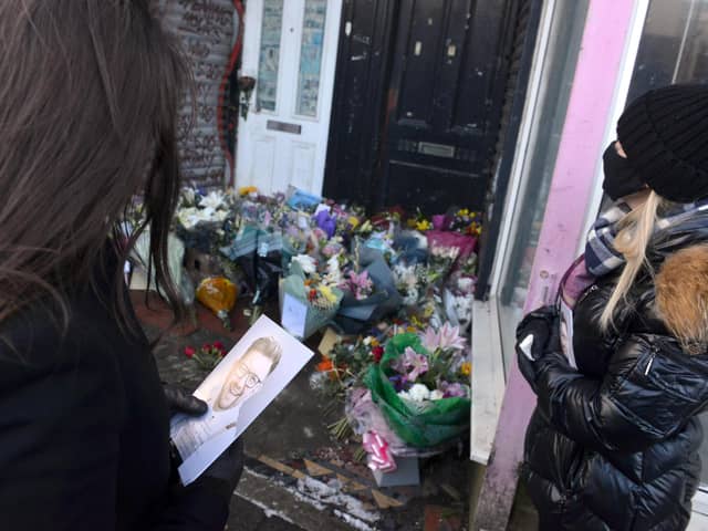 Tributes were left outside Stoney's Barber Shop.