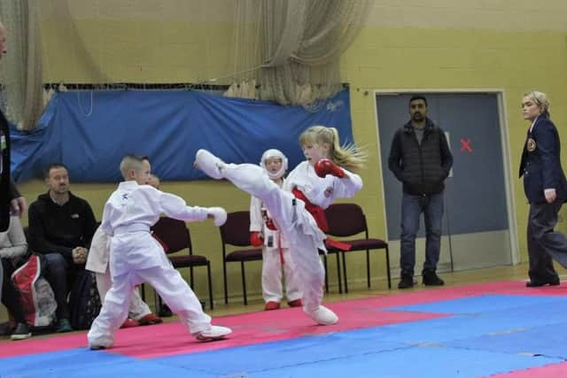 Holly Millward getting a kick out of karate.