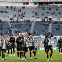 Newcastle United's players thank the fans after the English Premier League football match between Burnley and Liverpool at Turf Moor in Burnley, north west England on May 19, 2021. - Newcastle won the game 1-0.