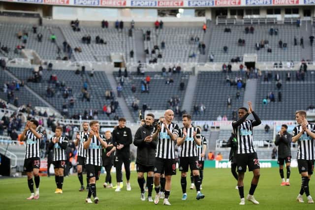Newcastle United's players thank the fans after the English Premier League football match between Burnley and Liverpool at Turf Moor in Burnley, north west England on May 19, 2021. - Newcastle won the game 1-0.