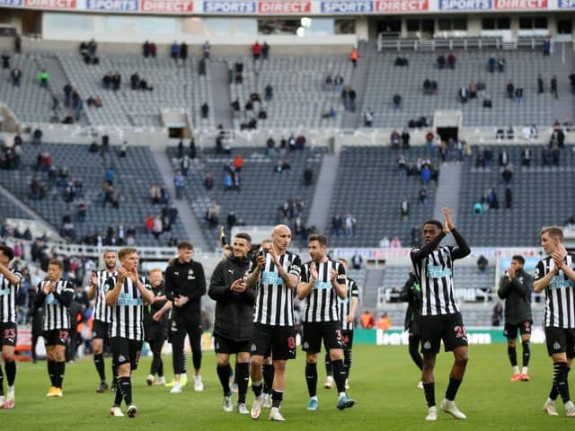 Newcastle United's players thank the fans after the English Premier League football match between Burnley and Liverpool at Turf Moor in Burnley, north west England on May 19, 2021. - Newcastle won the game 1-0.