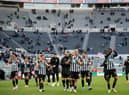 Newcastle United's players thank the fans after the English Premier League football match between Burnley and Liverpool at Turf Moor in Burnley, north west England on May 19, 2021. - Newcastle won the game 1-0.