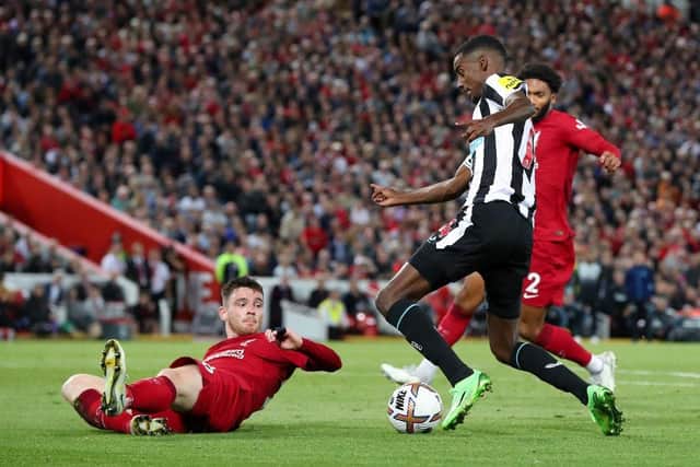 Andy Robertson of Liverpool challenges Alexander Isak of Newcastle United during the Premier League match between Liverpool FC and Newcastle United at Anfield on August 31, 2022 in Liverpool, England. (Photo by Alex Livesey/Getty Images)