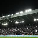 Newcastle United fans wave flags and scarves in the East Stand ahead of last night's Carabao Cup quarter-final against Leicester City.