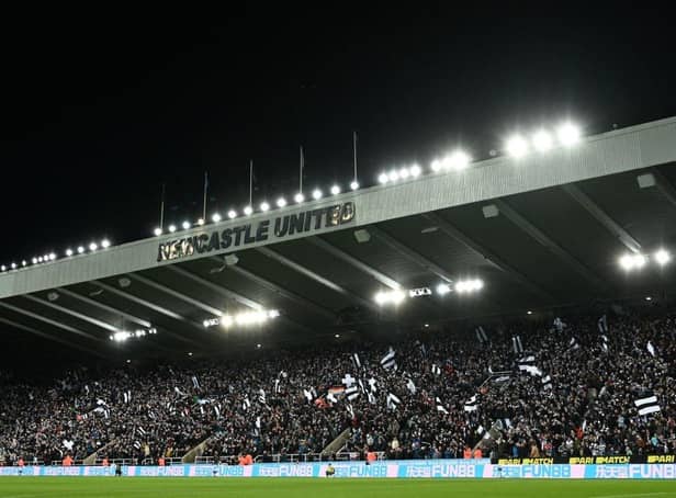 Newcastle United fans wave flags and scarves in the East Stand ahead of last night's Carabao Cup quarter-final against Leicester City.