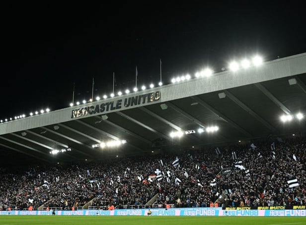 Newcastle United fans wave flags and scarves in the East Stand ahead of last night's Carabao Cup quarter-final against Leicester City.