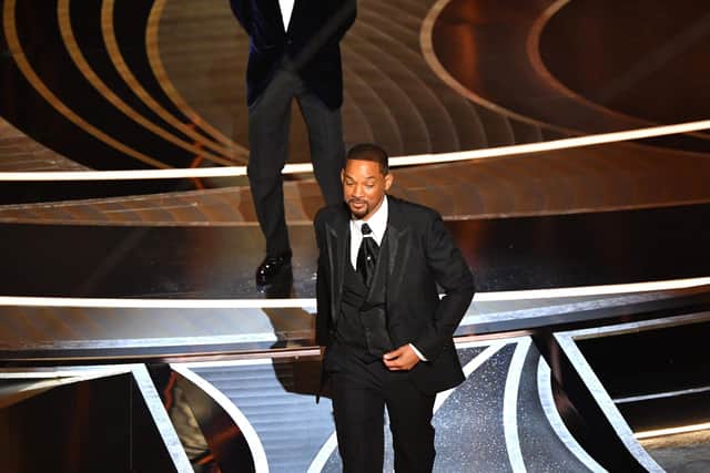 Will Smith leaving the stage after appearing to slap comedian Chris Rock. Photo by ROBYN BECK/AFP via Getty Images