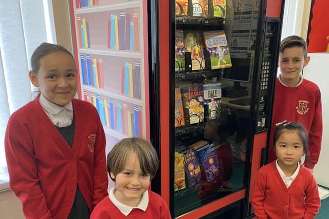 St Joseph's pupils with the book vending machine, dubbed the Dream Big Read Machine