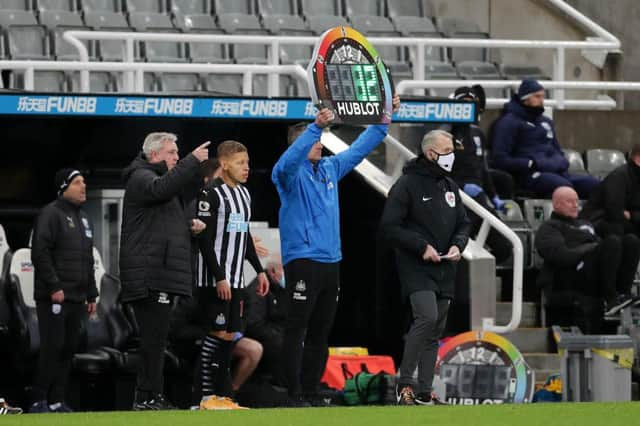 Dwight Gayle waits to come on against West Bromwich Albion.