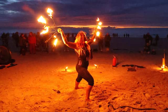 Pre-dip entertainment from fire eater Penella Bee.
Photograph: North News and Pictures NNP