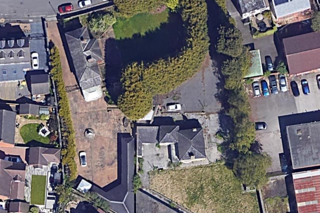 An aerial view of the site in happier times, showing Avenue Villa, at the top, and Avenue House, complete with horse sculpture in the driveway.