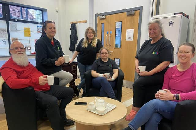 Katherine Mason-Gage manager of the Marsden Home Hub. (Standing centre) with staff Frank, Janet, Sherina, Margaret and Janet Picture by FRANK REID'