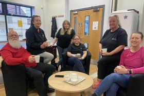Katherine Mason-Gage manager of the Marsden Home Hub. (Standing centre) with staff Frank, Janet, Sherina, Margaret and Janet Picture by FRANK REID'