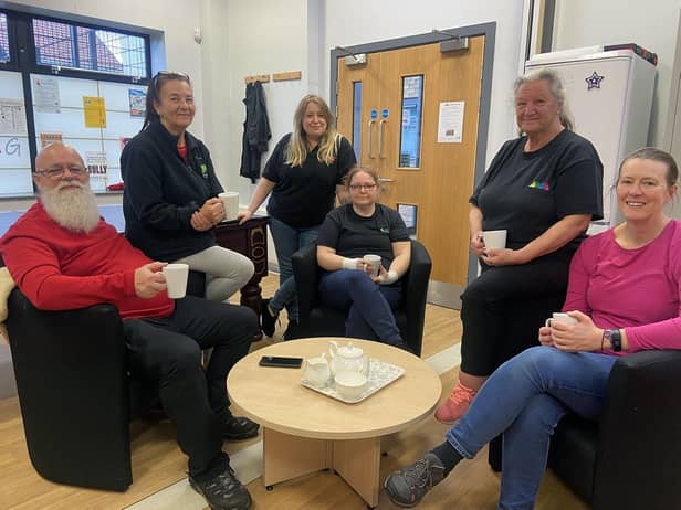 Katherine Mason-Gage manager of the Marsden Home Hub. (Standing centre) with staff Frank, Janet, Sherina, Margaret and Janet Picture by FRANK REID'