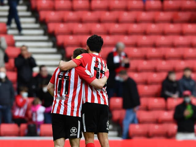 Lynden Gooch and Luke O’Nien at the end of the Lincoln City play-off game.