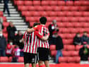 Lynden Gooch and Luke O’Nien at the end of the Lincoln City play-off game.