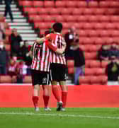 Lynden Gooch and Luke O’Nien at the end of the Lincoln City play-off game.