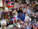 Anita Atkinson arranging the Queen and the Duke of Edinburgh's section of her royal memorabilia collection. Picture: Owen Humphreys/PA Wire.