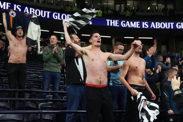 Newcastle United fans celebrate the win over Tottenham Hotspur.