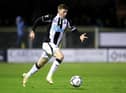 Elliot Anderson of Newcastle United runs with the ball during the Papa John's EFL Trophy Group match between Harrogate Town and Newcastle United U21's at The EnviroVent Stadium on October 05, 2021 in Harrogate, England. (Photo by George Wood/Getty Images)