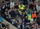 Medical personal were called to assist a fan in the stands during the Premier League match at St. James' Park, Newcastle. Picture PA.