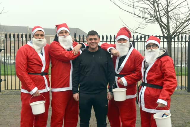 Charity walk for the Wrap for Jak appeal in memory of Jak Fada. Santa's Liam Fada, Danny Fada, John Fada and Scott West with Jak's dad Tony Fada.